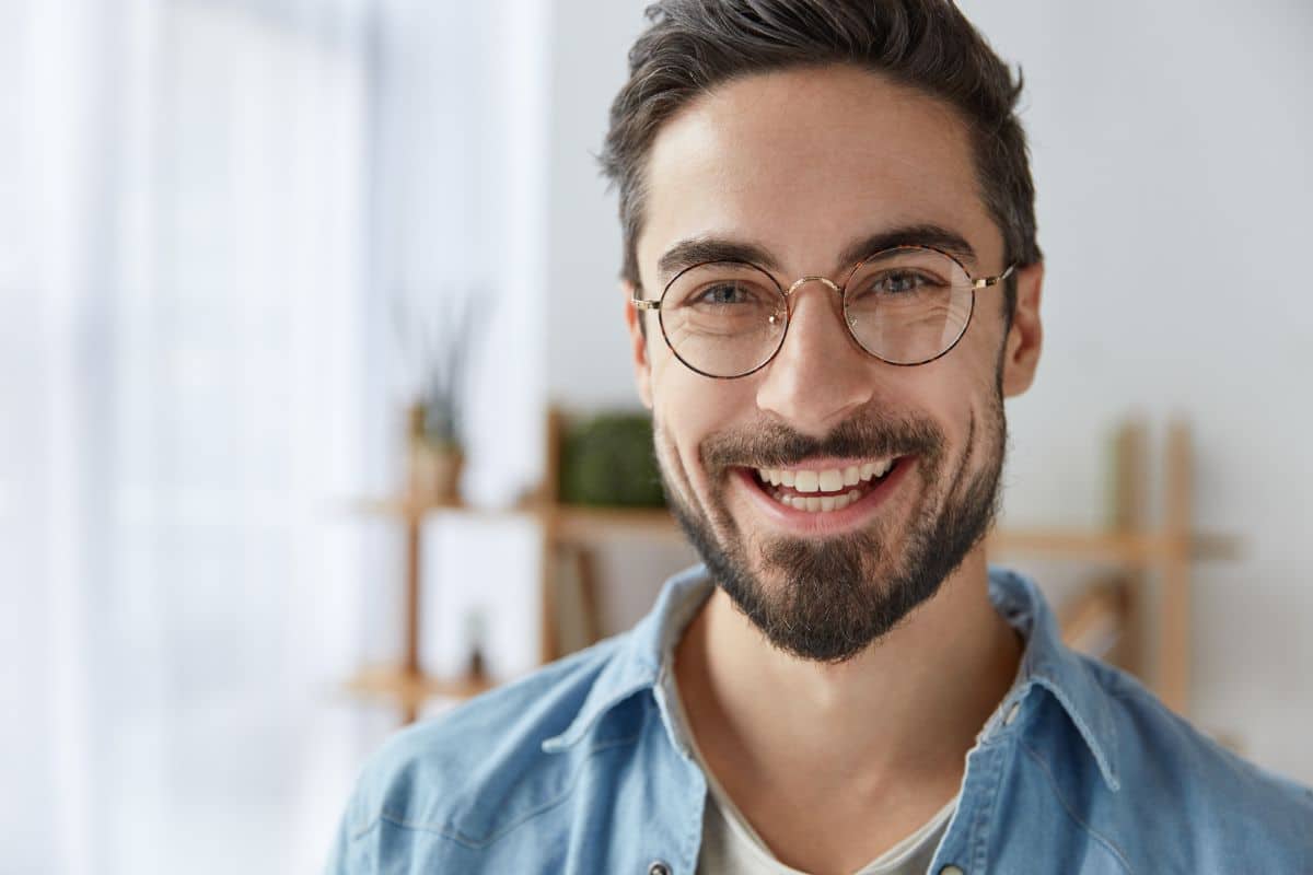 Man smiling with straight teeth after periodontal disease treatment at tuckahoe creek dental in richmond, va.
